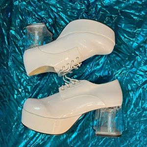 White 70s John Travolta platform shoes.